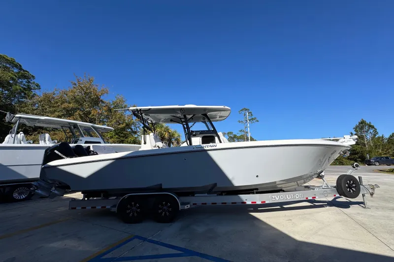  Yacht Photos Pics 2023 Fountain 34 Tournament Edition boat on trailer under clear blue sky.