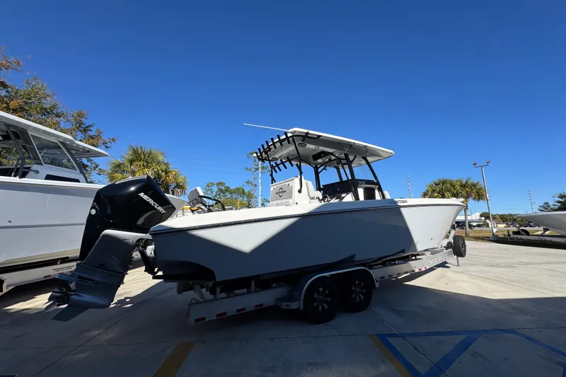  Yacht Photos Pics 2023 Fountain 34 Tournament Edition boat on trailer, parked outdoors under clear blue sky.