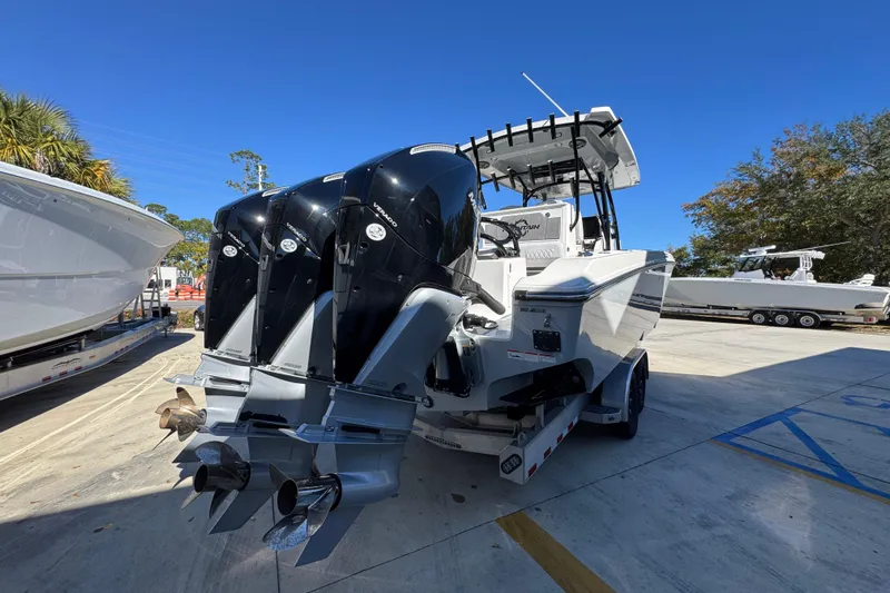  Yacht Photos Pics 2023 Fountain 34 Tournament Edition boat with triple outboard engines on a trailer.