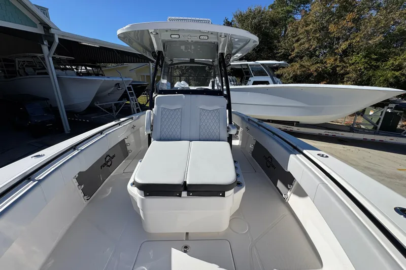  Yacht Photos Pics 2023 Fountain 34 Tournament Edition boat with sleek seating and modern design.