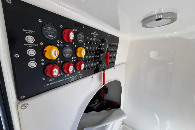  Yacht Photos Pics Control panel of 2023 Fountain 34 Tournament Edition boat, featuring switches and indicators.