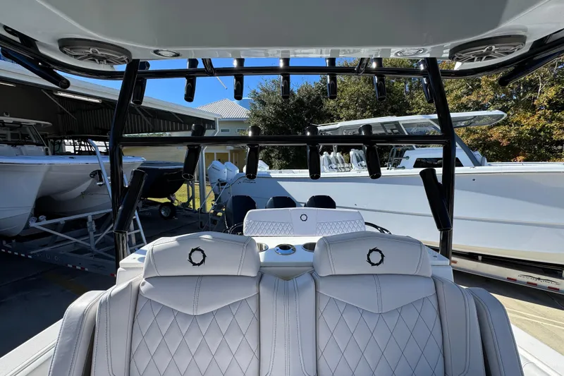  Yacht Photos Pics 2023 Fountain 34 Tournament Edition boat interior with luxurious seating and rod holders.
