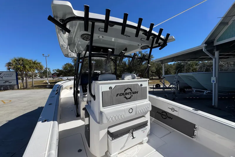  Yacht Photos Pics 2023 Fountain 34 Tournament Edition boat with rod holders and seating, docked outdoors.
