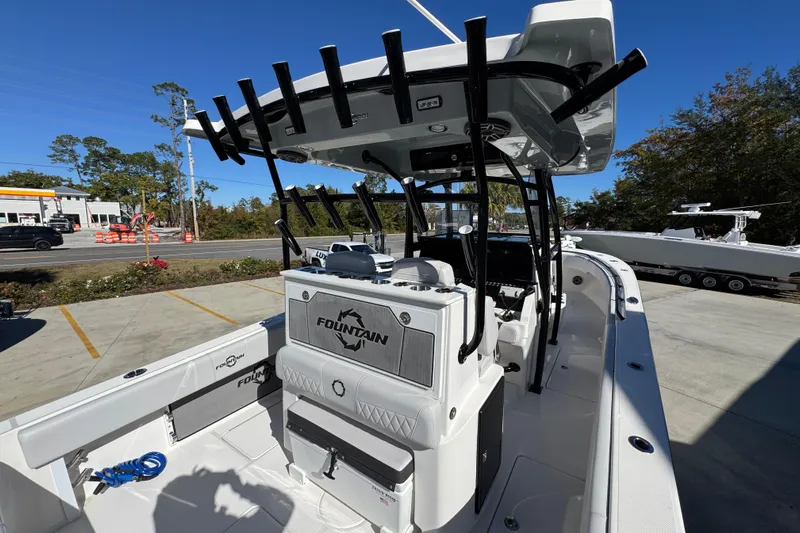  Yacht Photos Pics 2023 Fountain 34 Tournament Edition boat, sleek design, docked outdoors under clear blue sky.