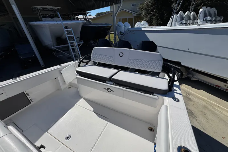  Yacht Photos Pics 2023 Fountain 34 Tournament Edition boat interior with seating and storage.