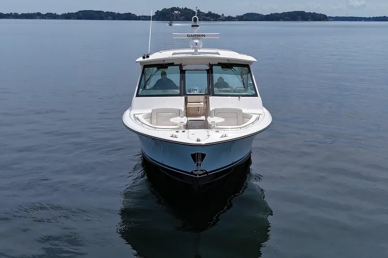  Yacht Photos Pics 2023 Grady-White Freedom 375 boat on calm water, front view.