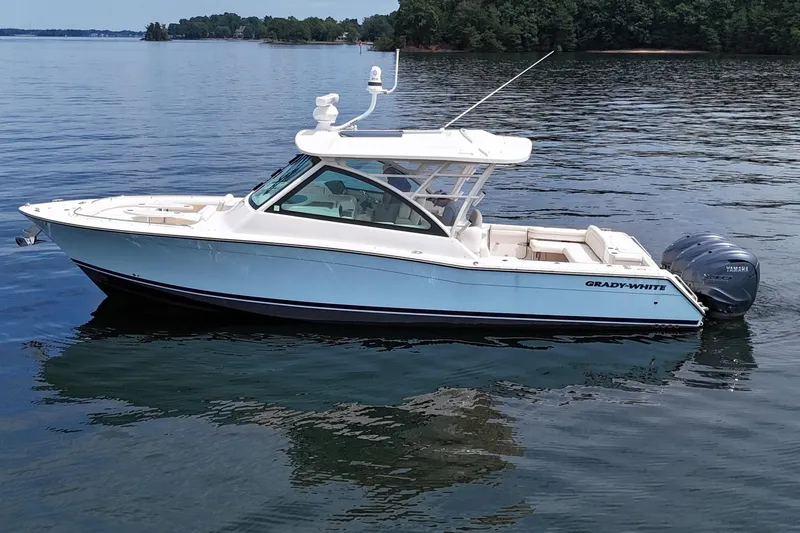  Yacht Photos Pics 2023 Grady-White Freedom 375 boat on calm lake waters.
