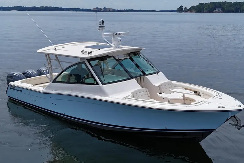  Yacht Photos Pics 2023 Grady-White Freedom 375 boat on calm water, showcasing sleek design and luxury features.