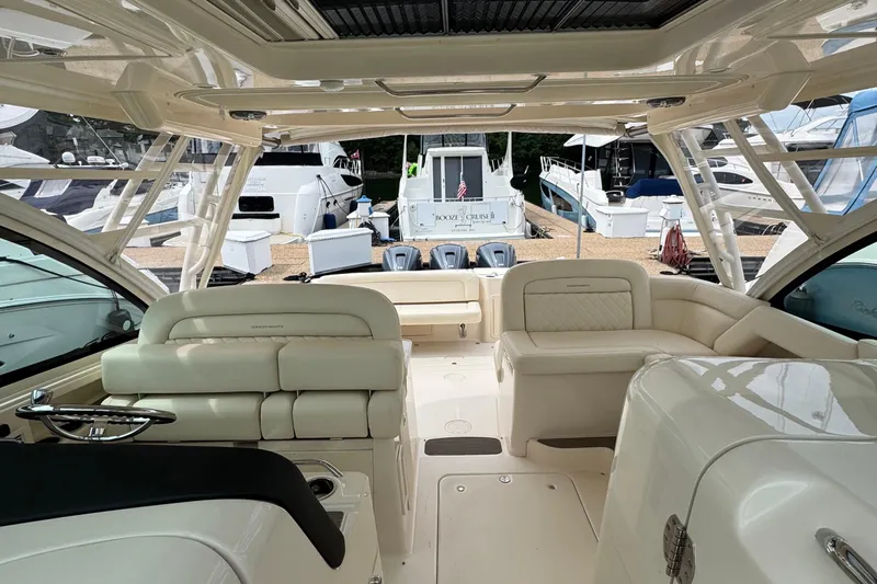  Yacht Photos Pics 2023 Grady-White Freedom 375 boat interior with luxurious seating and helm.