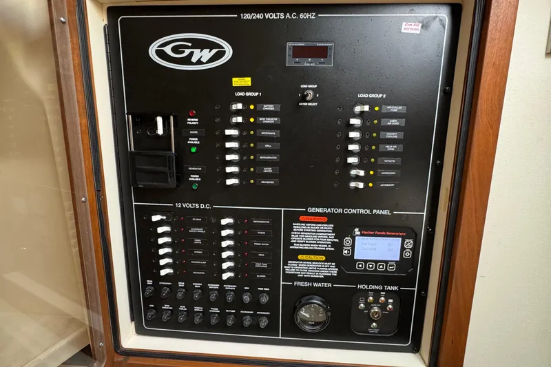 Yacht Photos Pics Electrical control panel on 2023 Grady-White Freedom 375 boat, featuring generator controls and switches.
