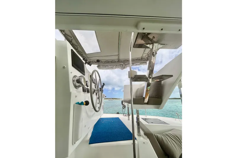 Sabai Sabai Yacht Photos Pics 2018 Fountaine Pajot Lucia 40 yacht helm with ocean view and modern controls.