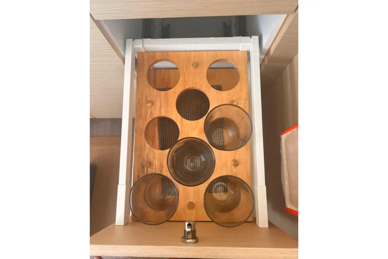 Sabai Sabai Yacht Photos Pics Glass holder in a 2018 Fountaine Pajot Lucia 40 yacht interior.