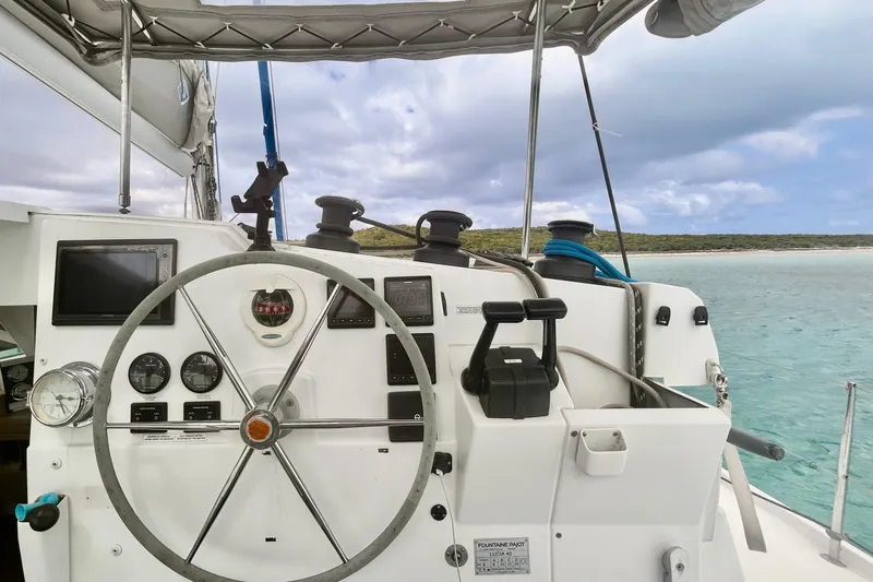 Sabai Sabai Yacht Photos Pics Helm of 2018 Fountaine Pajot Lucia 40 catamaran with ocean view.