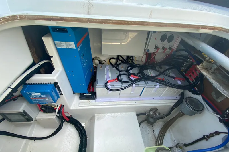 Sabai Sabai Yacht Photos Pics Electrical system of a 2018 Fountaine Pajot Lucia 40 catamaran, featuring batteries and wiring.