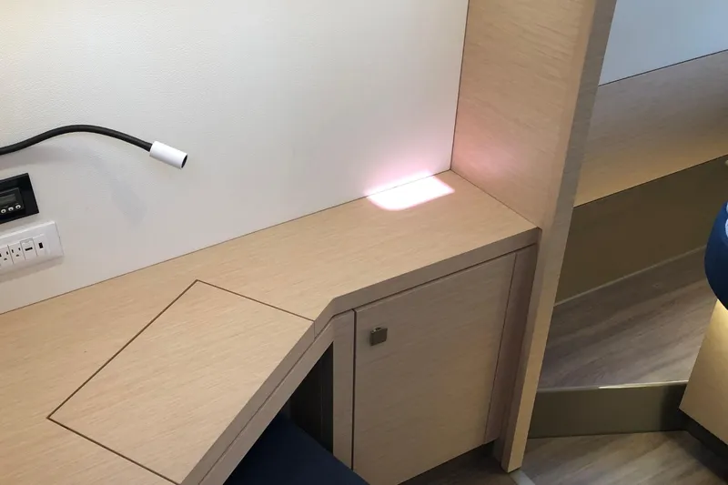 Sabai Sabai Yacht Photos Pics Modern interior of 2018 Fountaine Pajot Lucia 40 yacht with sleek wooden finish.