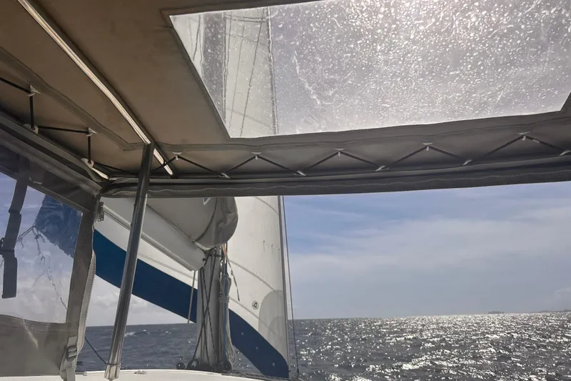 Sabai Sabai Yacht Photos Pics Sailing view from 2018 Fountaine Pajot Lucia 40 catamaran, ocean and sky in background.