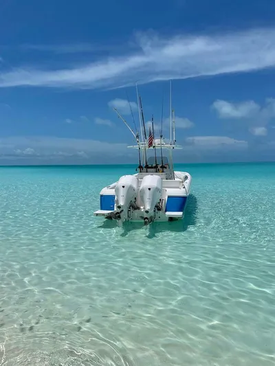  Yacht Photos Pics Intrepid 32 boat in clear turquoise water under blue sky, 2011 model.