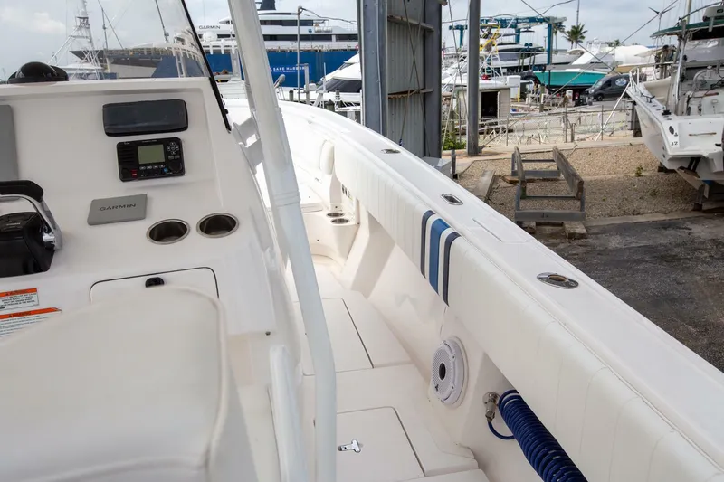 Yacht Photos Pics 2011 Intrepid 32 boat interior with control panel, docked at marina.