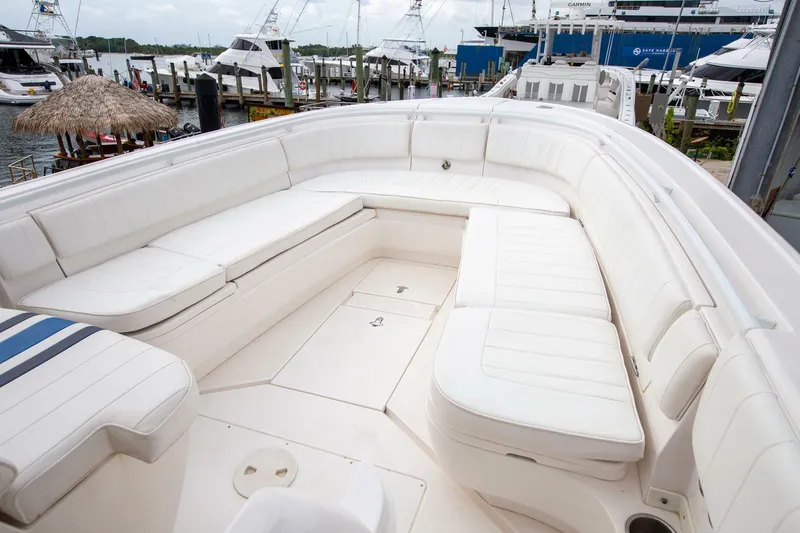  Yacht Photos Pics 2011 Intrepid 32 boat with spacious white seating at a marina.