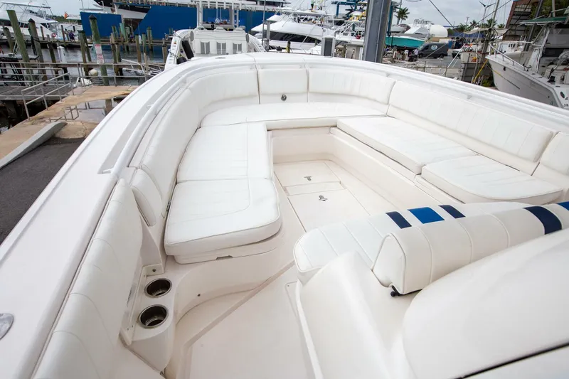  Yacht Photos Pics 2011 Intrepid 32 boat with spacious white seating area at a marina.