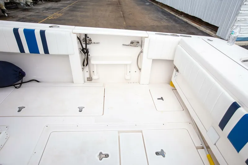  Yacht Photos Pics 2011 Intrepid 32 boat deck with storage compartments and seating.