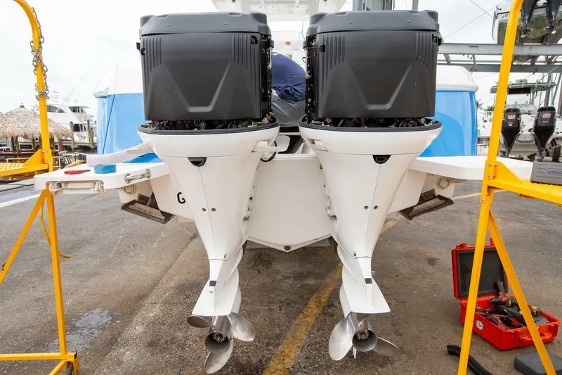  Yacht Photos Pics Twin outboard motors on a 2011 Intrepid 32 boat, dockside maintenance setup.