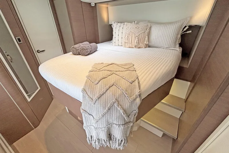 Crystal Dreams Yacht Photos Pics Luxurious bedroom interior on 2022 Bali 5.4 yacht with cozy bedding and elegant decor.