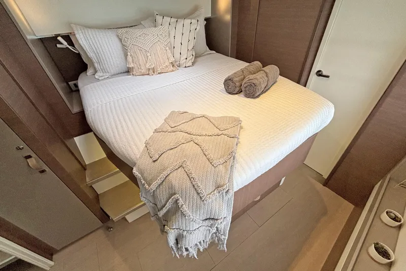 Crystal Dreams Yacht Photos Pics Luxurious Bali 5.4 yacht bedroom, 2022 model, with cozy bedding and elegant decor.