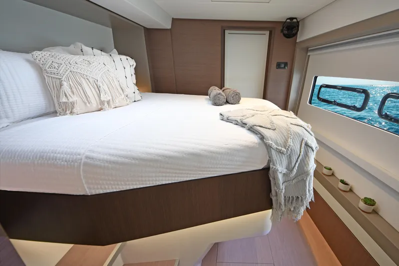 Crystal Dreams Yacht Photos Pics Luxurious bedroom interior of 2022 Bali 5.4 yacht with ocean view window.