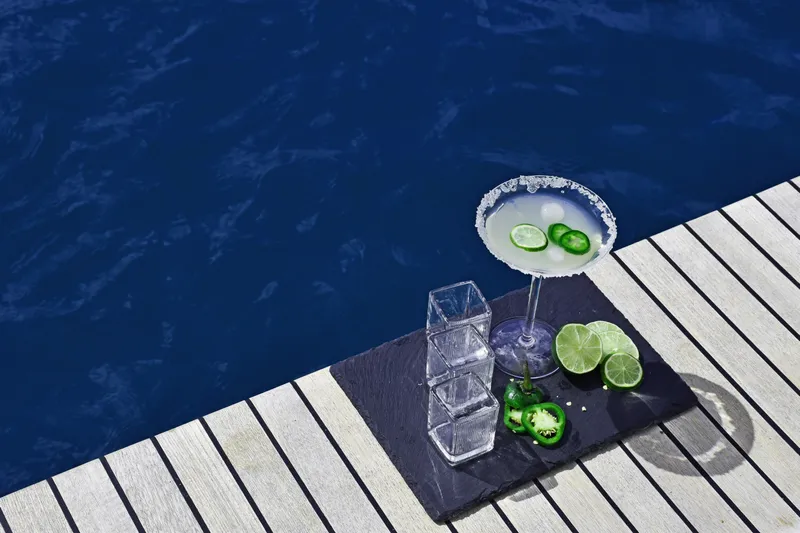 Crystal Dreams Yacht Photos Pics Cocktail with lime and jalapeño on a yacht deck, Bali 5.4, 2022.