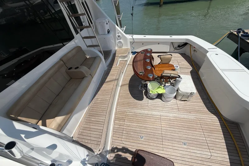 62025 Yacht Photos Pics 2016 Viking 62 Convertible yacht deck with seating and fishing chair.