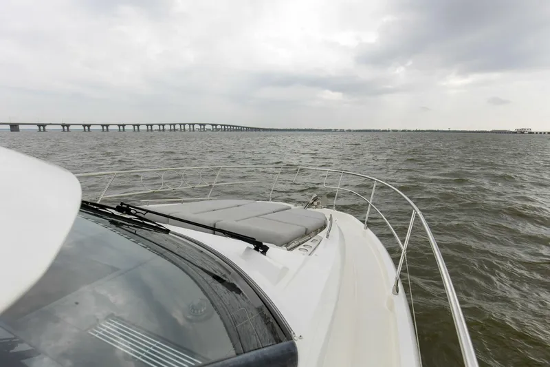 Pass-n-bye Yacht Photos Pics Prestige 460 Flybridge 2023 yacht cruising on open water under cloudy skies.