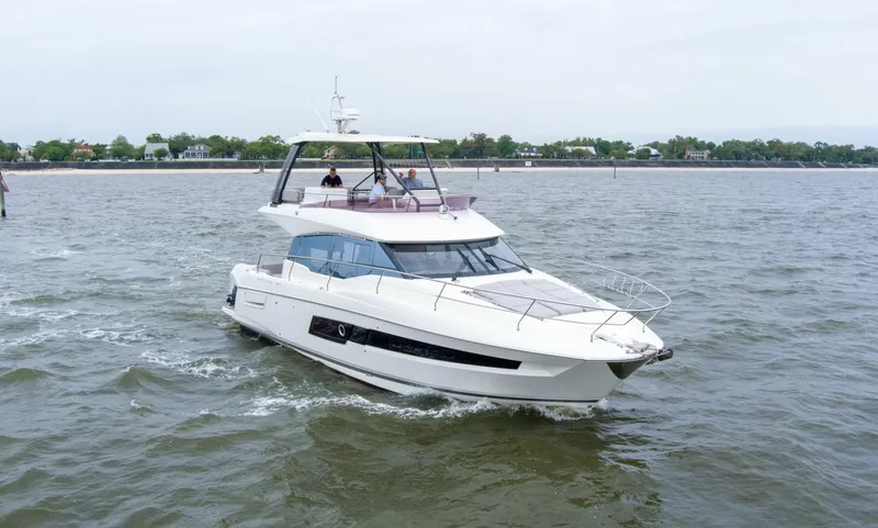 Pass-n-bye Yacht Photos Pics 2023 Prestige 460 Flybridge yacht cruising on open water.