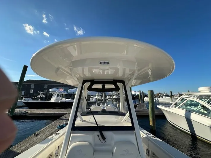 Cordon Bleu Yacht Photos Pics 2023 Regulator 34 boat docked under clear blue sky.