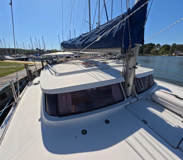 Quelle Belle Vie Yacht Photos Pics 2008 Fountaine Pajot Mahe 36 catamaran docked at a marina under clear blue skies.