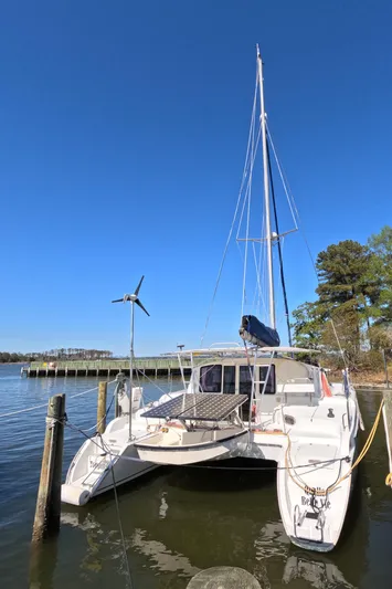 Quelle Belle Vie Yacht Photos Pics 2008 Fountaine Pajot Mahe 36 catamaran docked on a sunny day.