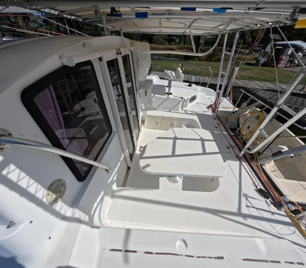 Quelle Belle Vie Yacht Photos Pics 2008 Fountaine Pajot Mahe 36 catamaran deck with seating and canopy.