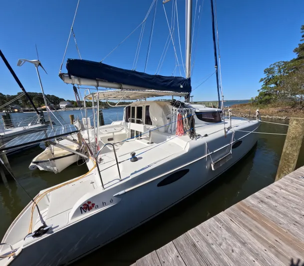 Quelle Belle Vie Yacht Photos Pics 2008 Fountaine Pajot Mahe 36 catamaran docked at a marina under clear blue skies.
