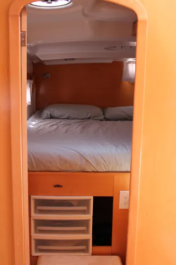 Quelle Belle Vie Yacht Photos Pics Cozy cabin interior of 2008 Fountaine Pajot Mahe 36 catamaran with bed and storage.