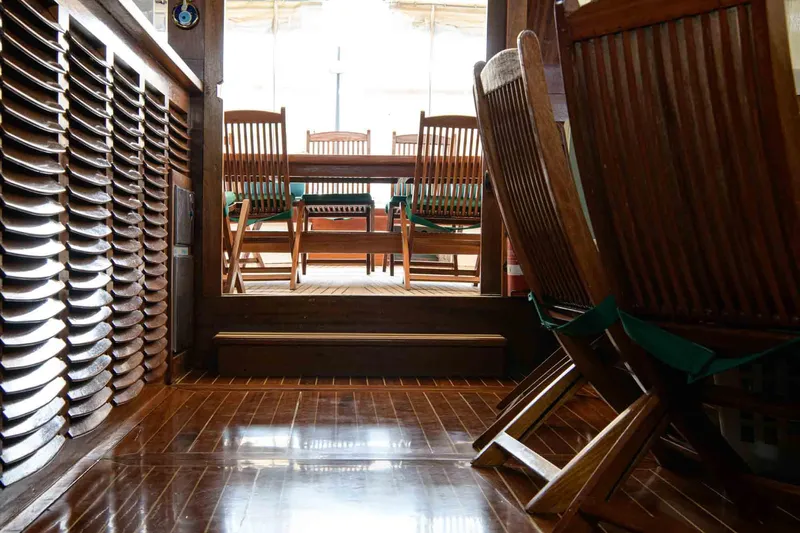  Yacht Photos Pics Interior of 2006 Classic Caicco ERDAL SOGUTCU yacht with wooden chairs and polished flooring.
