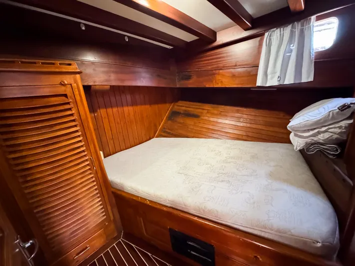  Yacht Photos Pics Wooden cabin interior of 2006 Classic Caicco ERDAL SOGUTCUK with cozy bed and window.