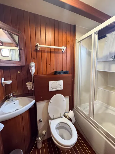  Yacht Photos Pics Bathroom interior of 2006 Classic Caicco ERDAL SOGUTCUK yacht with wood paneling.