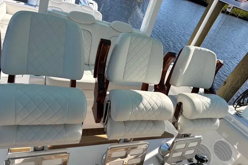  Yacht Photos Pics Luxurious seating on 2022 HCB 42 Lujo boat with quilted white upholstery.