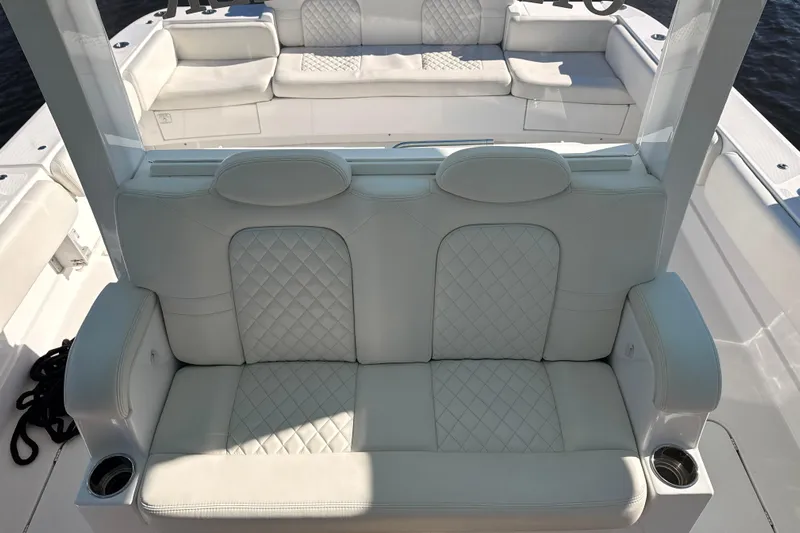  Yacht Photos Pics Luxurious seating on 2022 HCB 42 Lujo boat with quilted white upholstery.