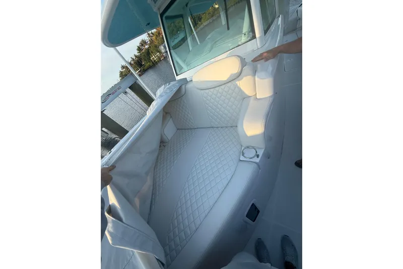  Yacht Photos Pics Luxurious seating on 2022 HCB 42 Lujo boat with quilted upholstery and cup holder.