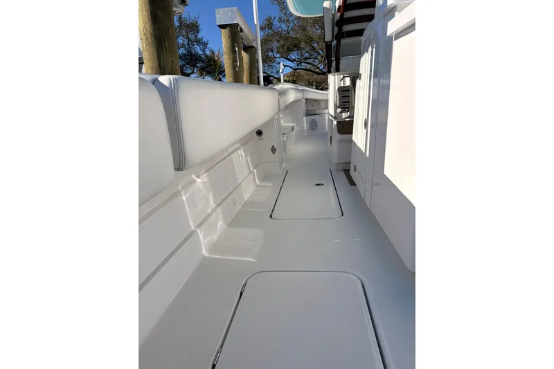  Yacht Photos Pics 2022 HCB 42 Lujo boat interior with sleek white deck and seating.