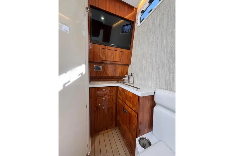 Yacht Photos Pics Luxurious interior of 2022 HCB 42 Lujo boat with wood cabinetry and modern amenities.