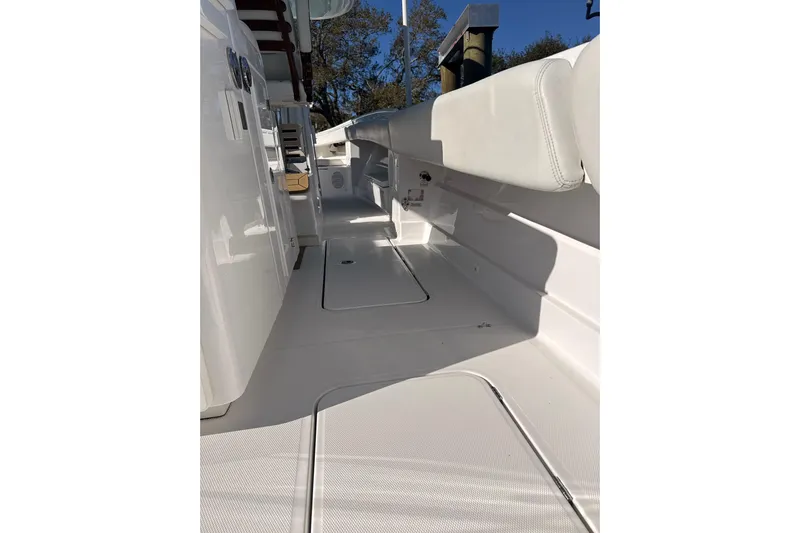  Yacht Photos Pics 2022 HCB 42 Lujo boat interior with sleek white seating and deck.