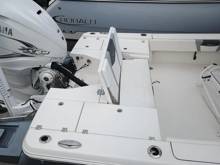 266 -105 Yacht Photos Pics 2023 Robalo 266 Cayman SD boat with Yamaha engine, featuring spacious seating and storage.