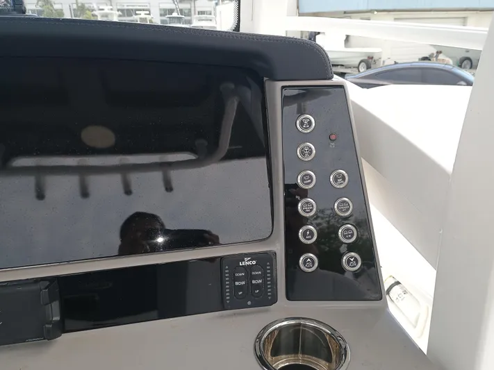 266 -105 Yacht Photos Pics Control panel of 2023 Robalo 266 Cayman SD boat with buttons and display.